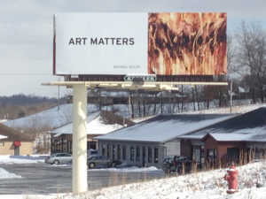 Art Matters billboard campaign for the artists in the Zanesville Artist Colony, Michael Seiler asphalt painting, Dances with Fire.