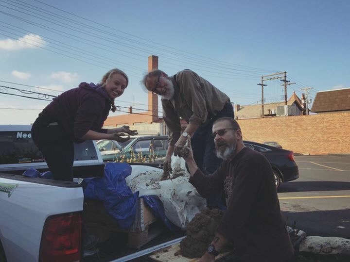 Unloading 1,000 pounds of clay